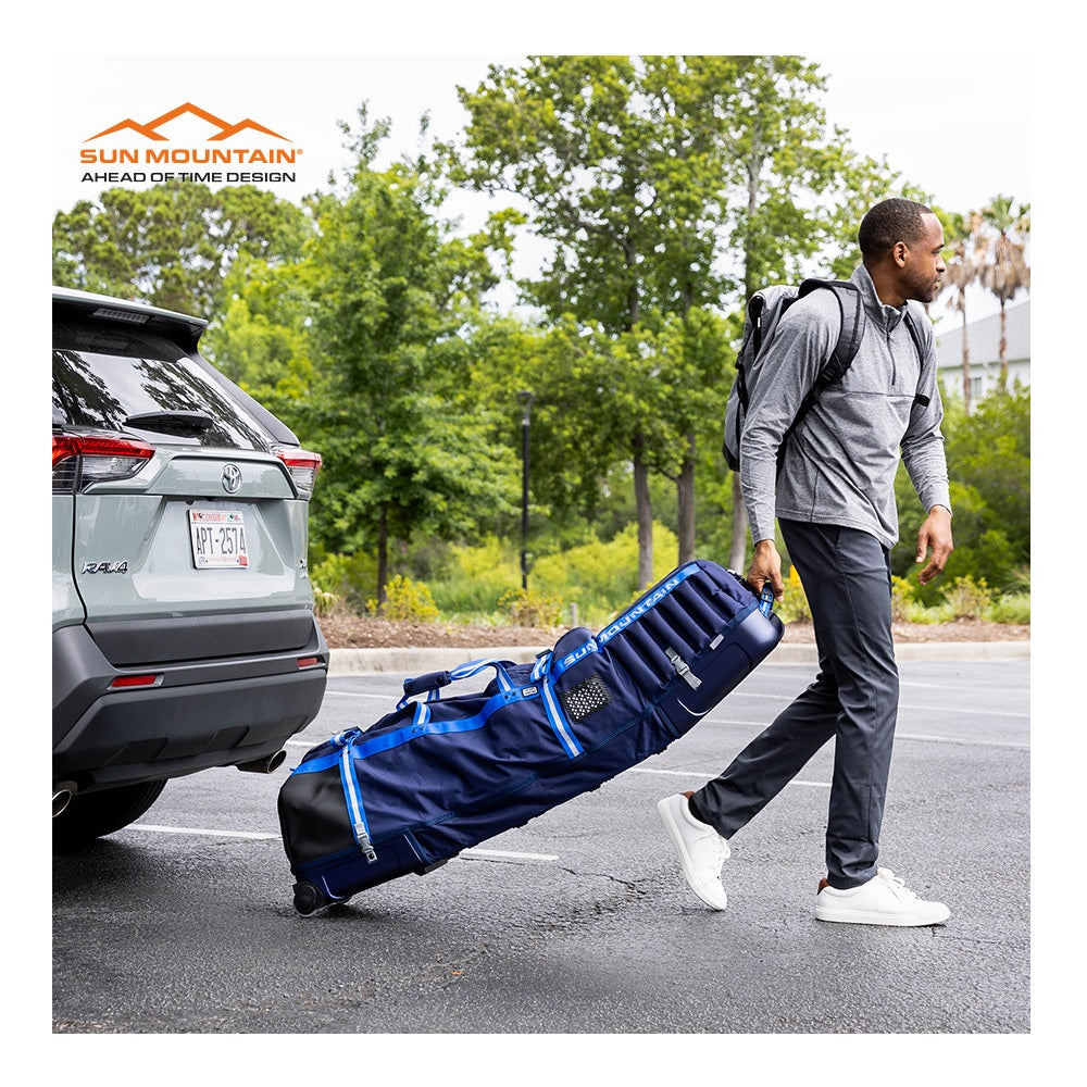 Sun Mountain Kube Golf Travel Cover being pulled by carry handle at airport