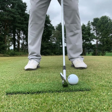 Spurk Golf Mat on golf course with iron 