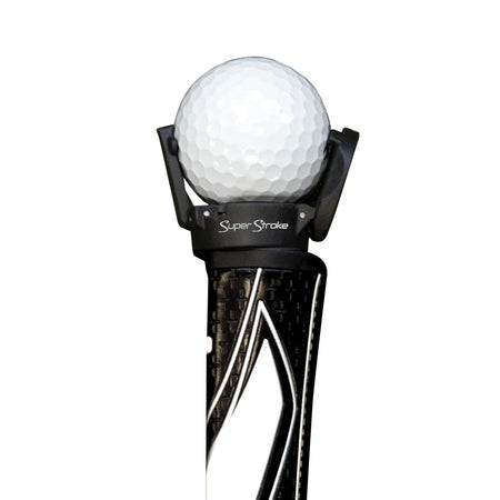SuperStroke Ball Pick Up attached to a putter grip holding a golf ball