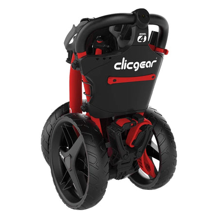 Red Clicgear 4.0 Push Golf Trolley folded for storage