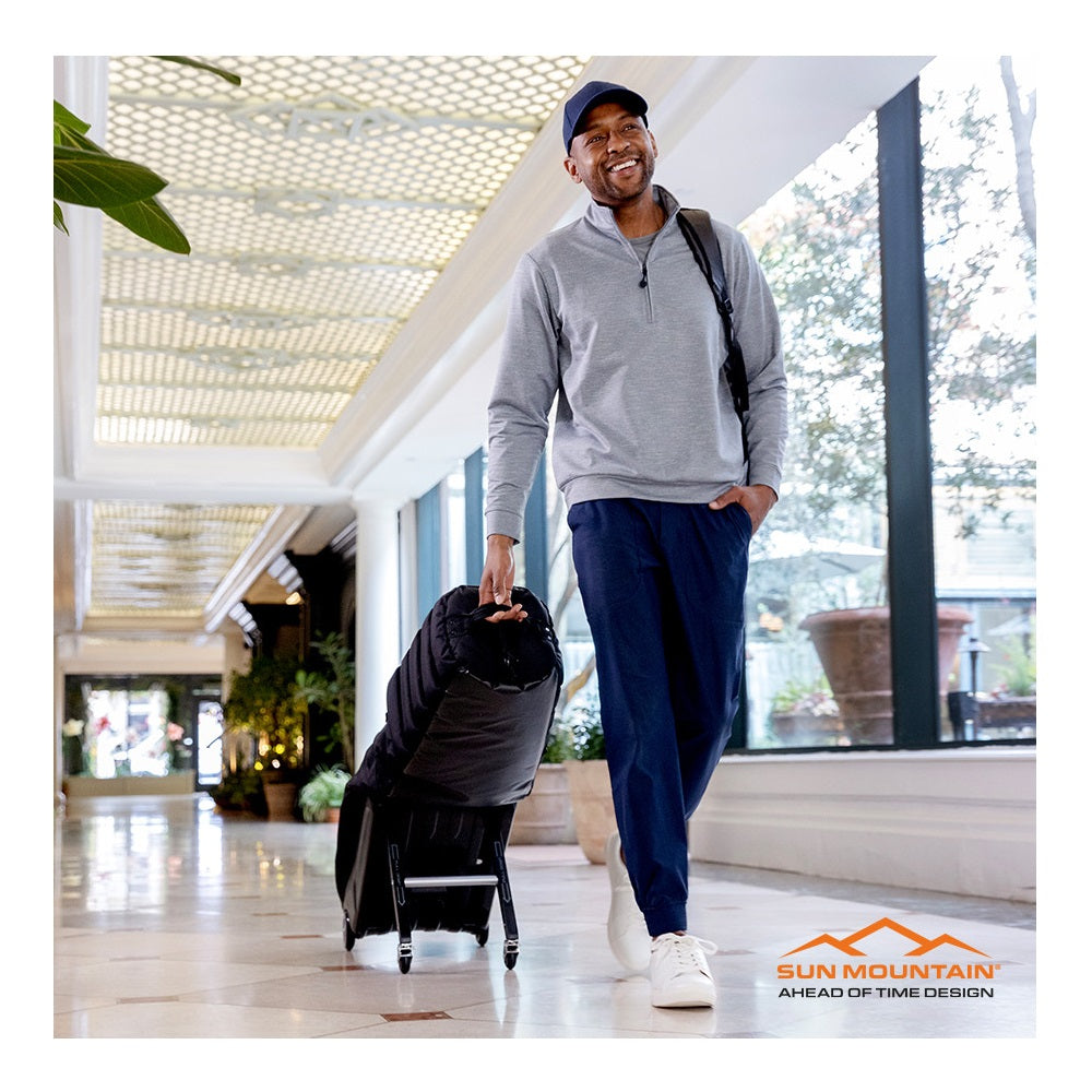 Sun Mountain ClubGlider Meridian Golf Travel Cover Flight Bag - Black - in transit using wheels and pull handle