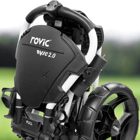 Folded Rovic RV1C 2.0 in Arctic/Black golf trolley outdoors