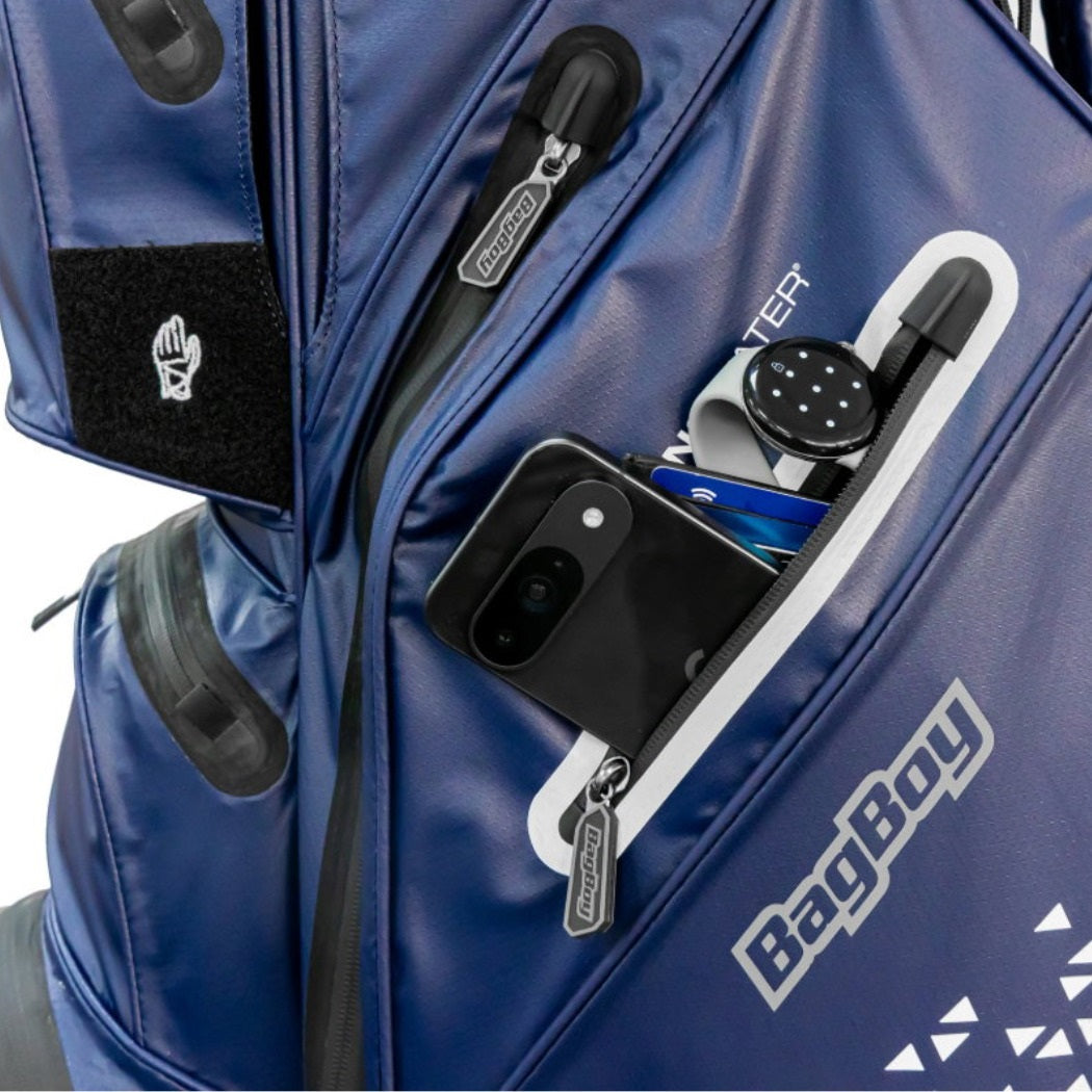 Close-up of the BagBoy Technowater Cart Bag in Navy, valuables pocket holding a phone and watch (phone and watch not included)