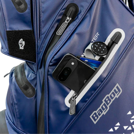 Close-up of the BagBoy Technowater Cart Bag in Navy, valuables pocket holding a phone and watch (phone and watch not included)
