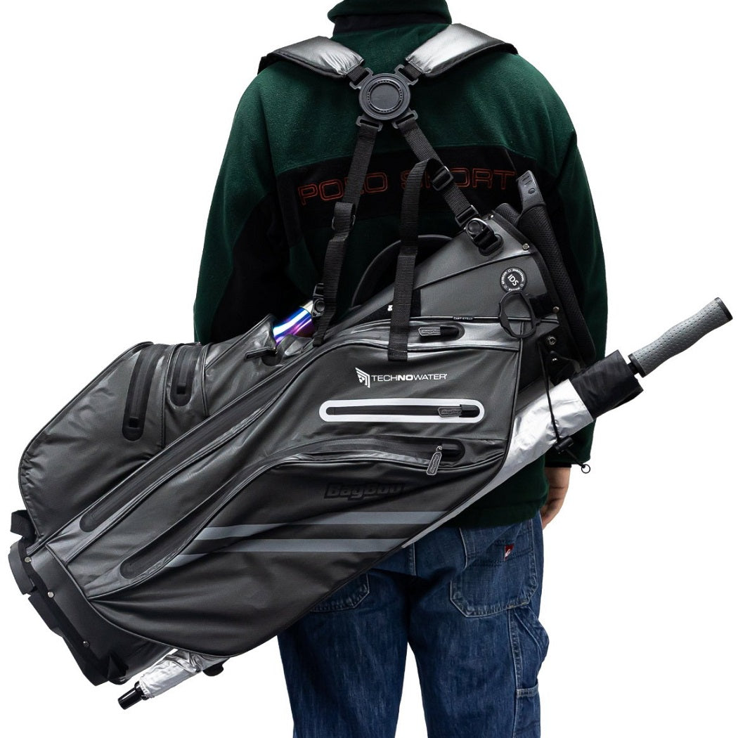 Golfer carrying a BagBoy Technowater Hybrid Stand Bag in Slate on their back