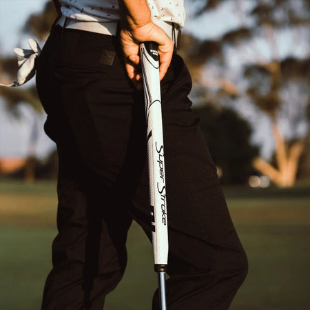 Golfer holding a putter fitted with a SuperStroke Zenergy Tour 1.0 17 inch White/Black grip