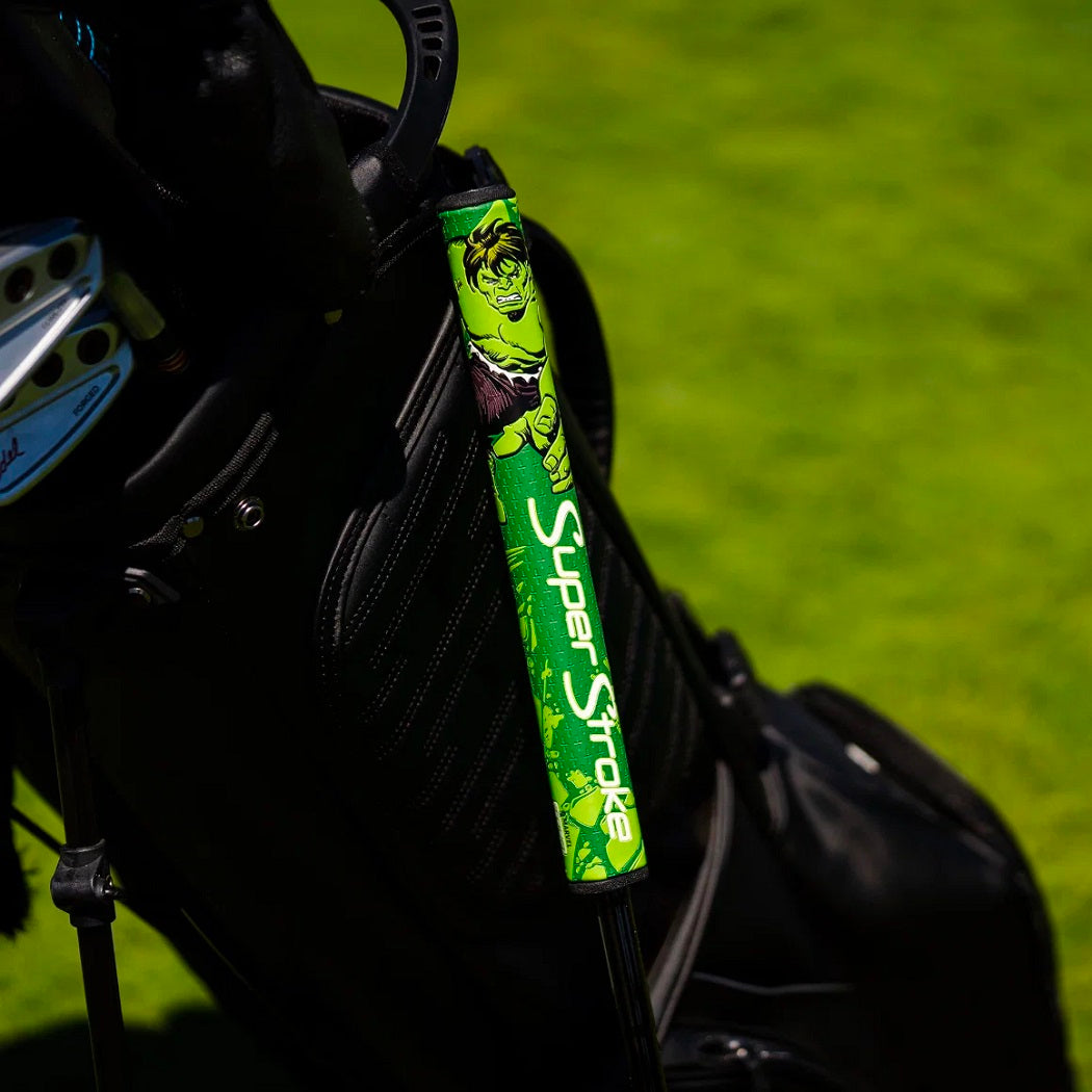 Green SuperStroke Marvel Hulk putter grip fitted to a putter beside a golf bag (bag not included)
